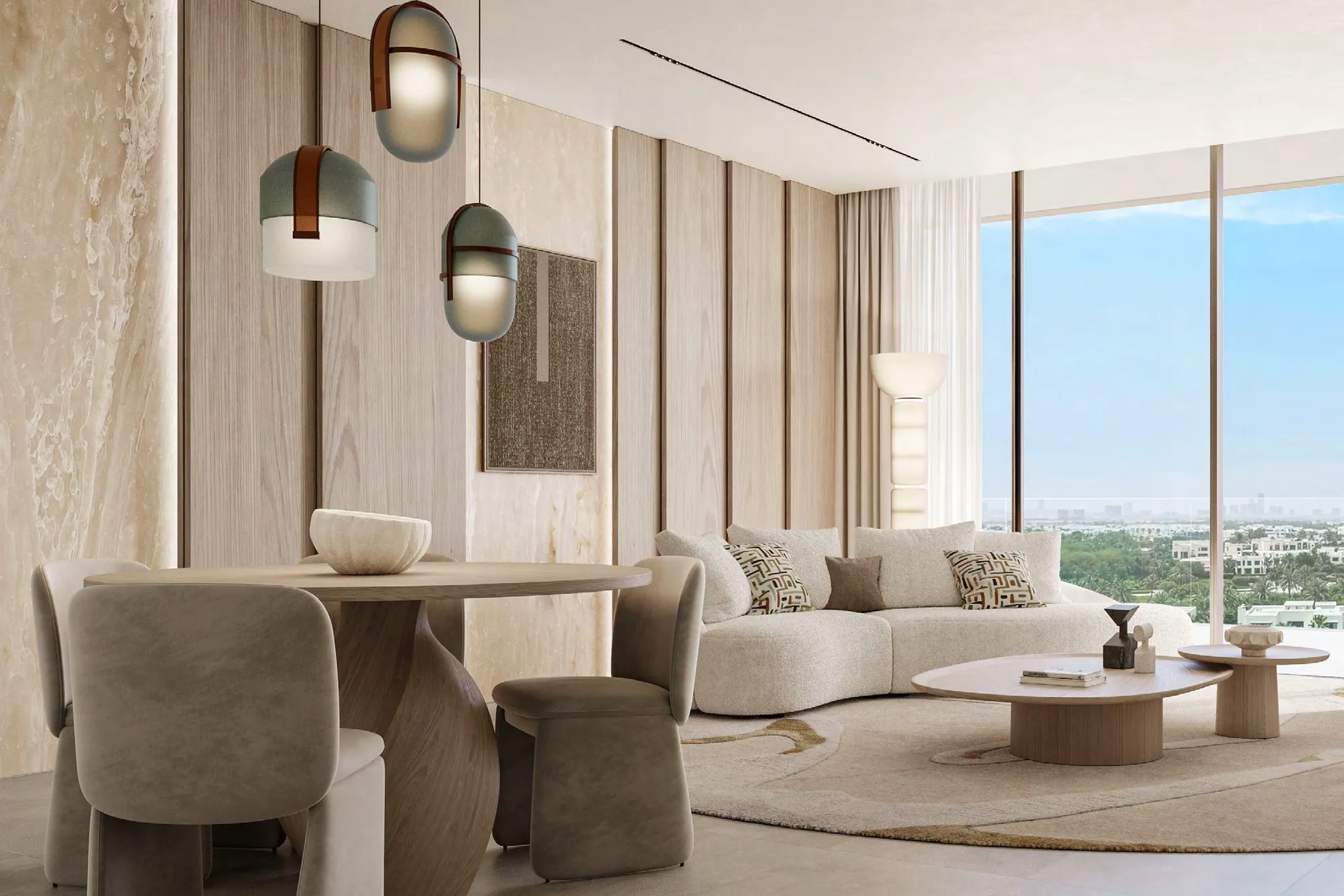 Living and dining room with stone walls, pendant lights and garden views