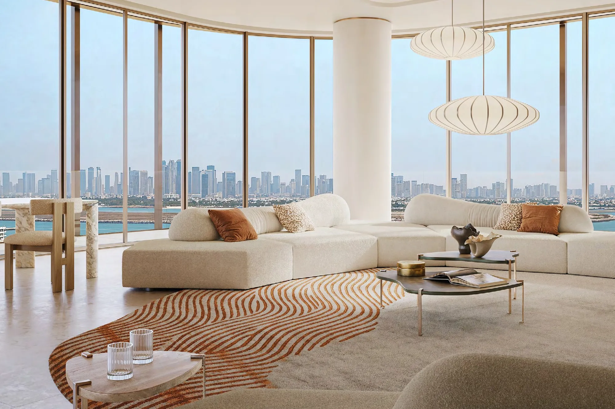 Curved living room with wraparound glazing and city skyline views